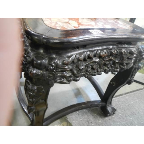 1557 - A carved Chinese table with marble inset top, COLLECT ONLY.