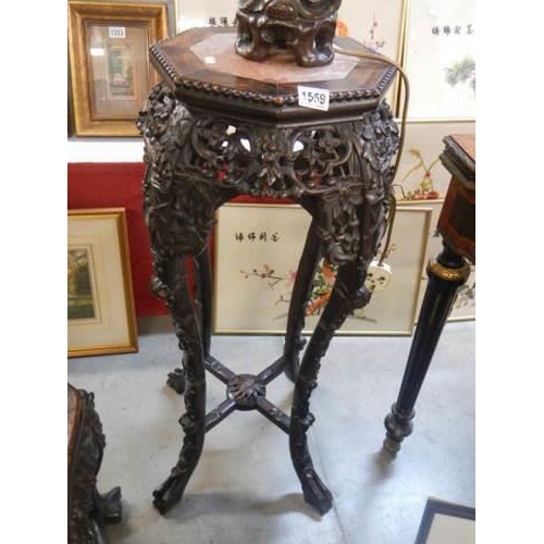 1559 - A carved Chinese pot stand with marble inset top, COLLECT ONLY.