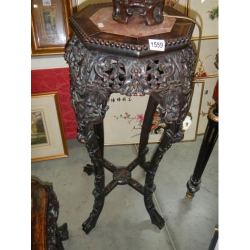 1559 - A carved Chinese pot stand with marble inset top, COLLECT ONLY.