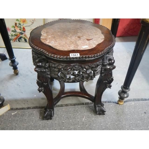 1561 - A carved Chinese table with marble inset top, COLLECT ONLY.