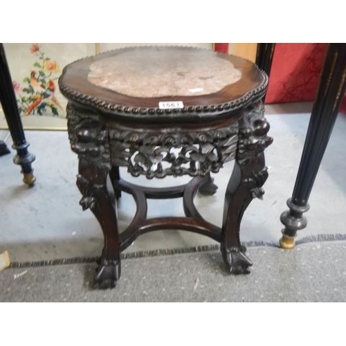 1561 - A carved Chinese table with marble inset top, COLLECT ONLY.