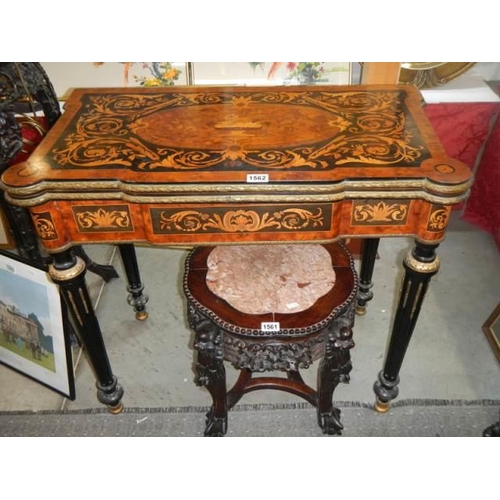 1562 - A Victorian marquetry inlaid fold over games table (felt need replacing), COLLECT ONLY.