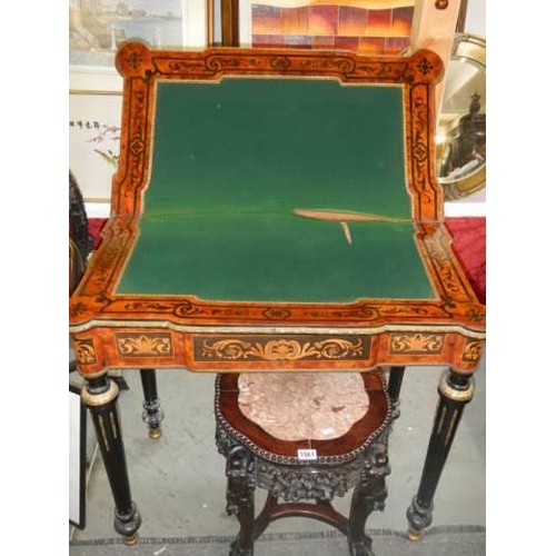 1562 - A Victorian marquetry inlaid fold over games table (felt need replacing), COLLECT ONLY.