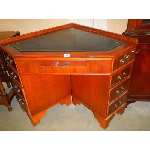 1567 - A good mahogany corner desk with leather inset top. COLLECT ONLY.