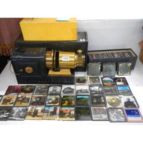 1578 - A Victorian magic lantern in metal box (converted to electric) with in excess of 160 glass slides. C... 