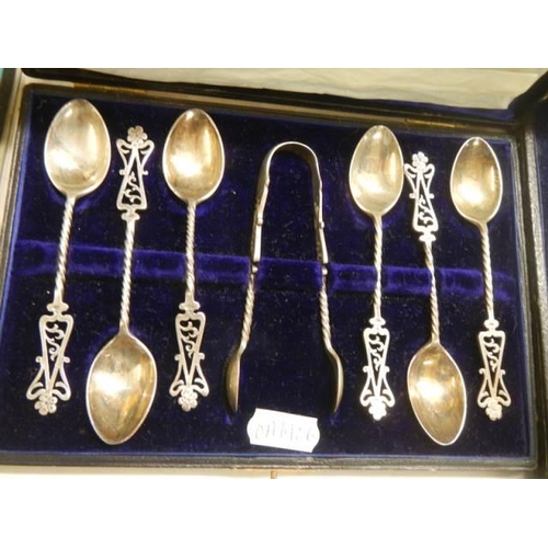 1581 - A set of silver spoons and a pair of fish servers.