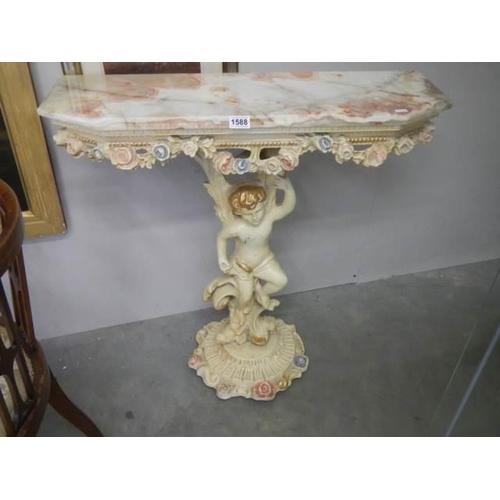 1588 - A good quality console table supported by a cherub, COLLECT ONLY.