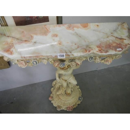 1588 - A good quality console table supported by a cherub, COLLECT ONLY.