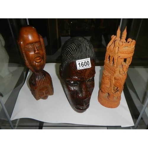 1600 - Two native carved wood heads and one other item.