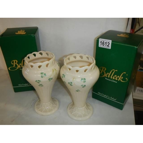 1612 - A boxed pair of Belleek vases.