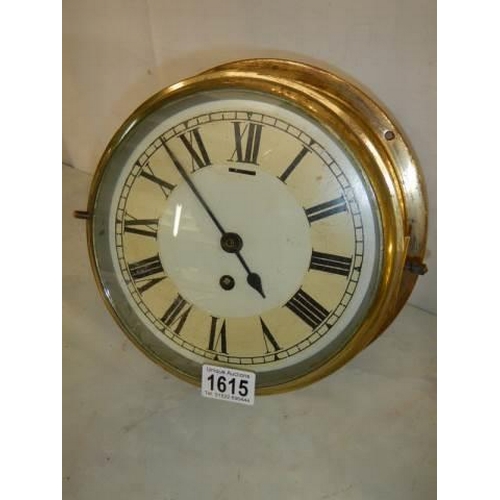 1615 - A brass ships clock in good working order (dial needs touching up in places) complete with key. COLL... 