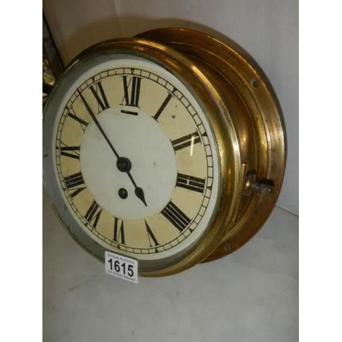 1615 - A brass ships clock in good working order (dial needs touching up in places) complete with key. COLL... 