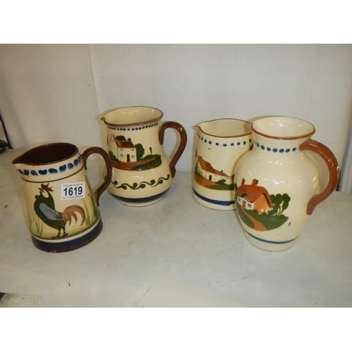 1619 - Four assorted Torqay motto ware jugs, all in good condition.