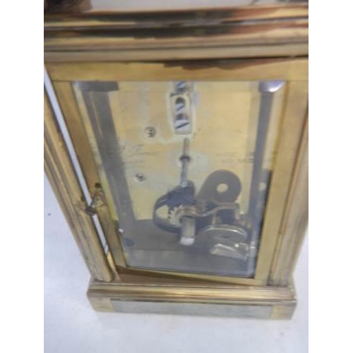 1621 - A St. James brass carriage clock in working order (slight crack in rear door).