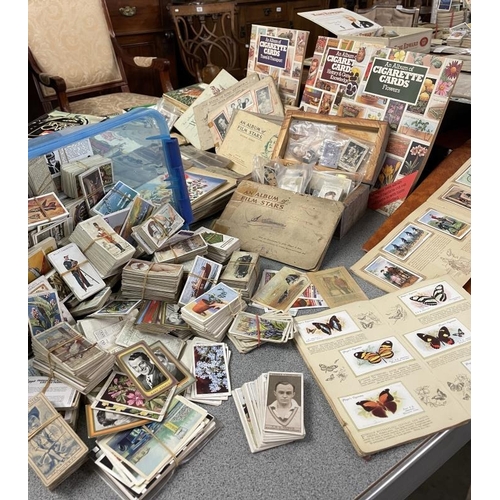 1630 - A large collection of cigarette and tea cards in three boxes.