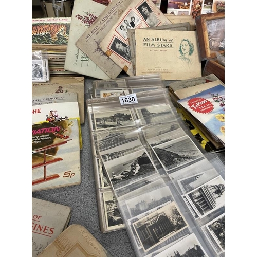 1630 - A large collection of cigarette and tea cards in three boxes.