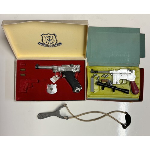 187 - A boxed Lone Star Luger presentation set. Incomplete  A 7.63mm automatic toy gun A/F, & A catapult A... 