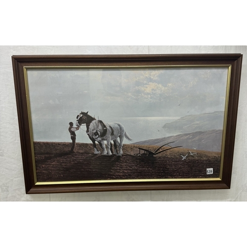 539 - A framed print of working heavy horses on a coastal cliff