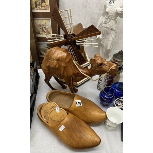 540 - A wooden windmill & clogs & a leather camel