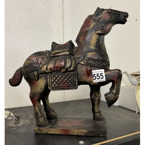 555 - A pair of wooden Tang horses