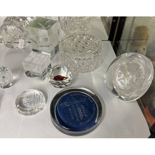 556 - A quantity of 1990s Ruston glass paperweights & clock etc