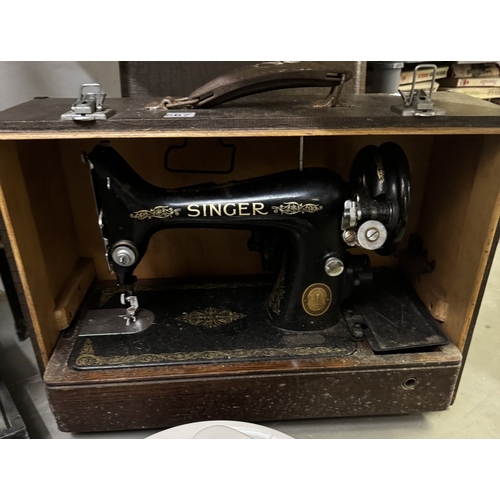 567 - A cased Singer sewing machine COLLECT ONLY