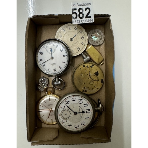 582 - A tray of pocket watch spares