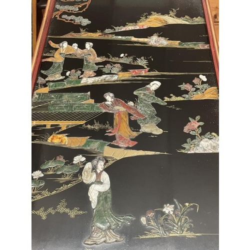 1517 - An excellent black lacquered panel with Chinese soapstone figures made into a table with a glazed to... 