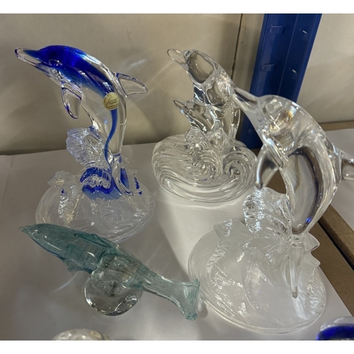 652 - A quantity of glass dolphins