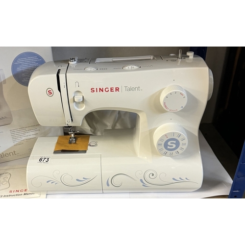 673 - A boxed Singer Talent 3323 sewing machine