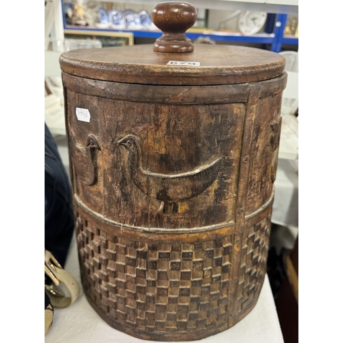 679 - A large lidded wooden barrel sided box carved with birds