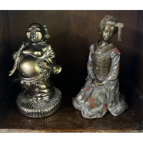 687 - A collection of 20th century oriental figures including Buddha and other Dieties.