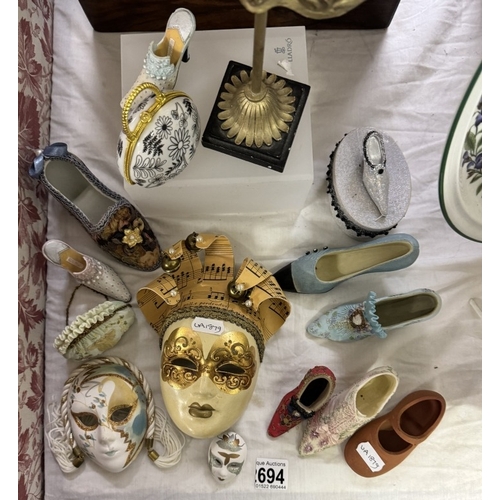 694 - A quantity of decorative shoes, facemasks, handbags etc