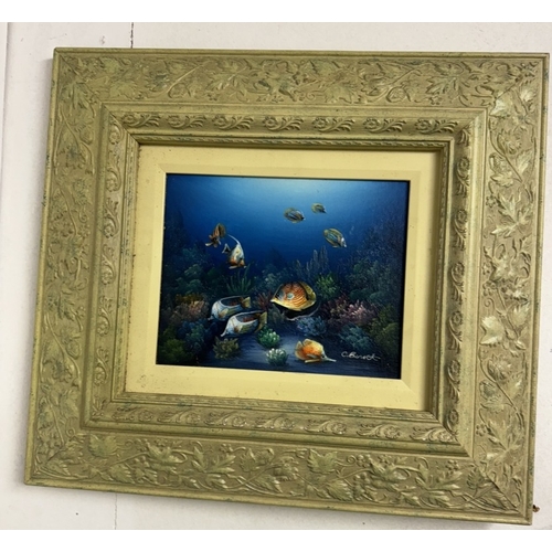 740 - A pair of ornate framed oil on boards of tropical / angel fish signed C Benett