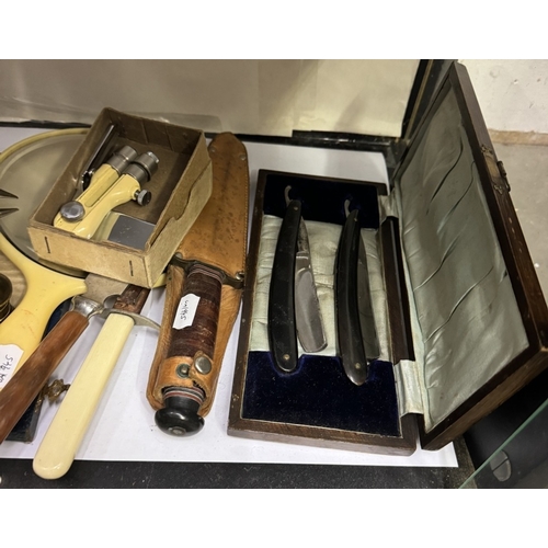 748 - A mixed lot including cut throat razors, vintage blades, cutlery sets, metalware etc