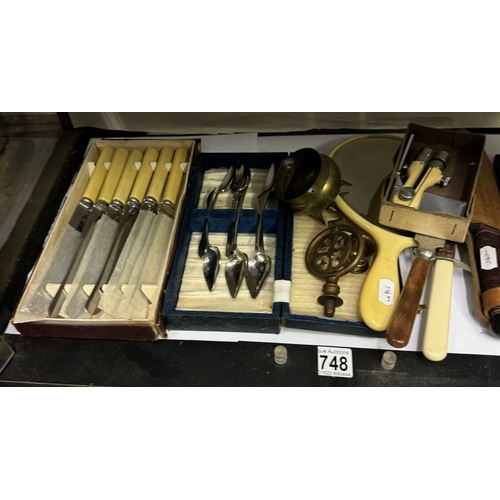 748 - A mixed lot including cut throat razors, vintage blades, cutlery sets, metalware etc