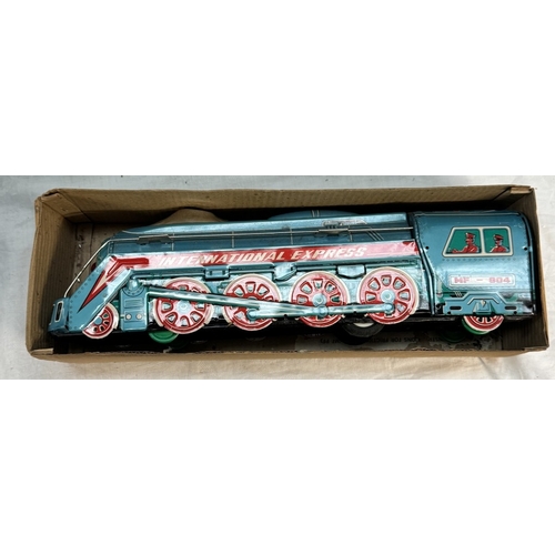 866 - A boxed international express locomotive, Paya clockwork tinplate bus & A large Mettoy tin lithograp... 