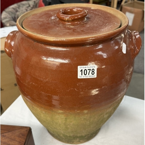 1078 - A large part glazed stoneware lidded jar. Height 40cm