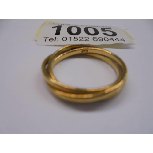 1005 - An 18ct (750) gold ring, size N, 4.5 grams.