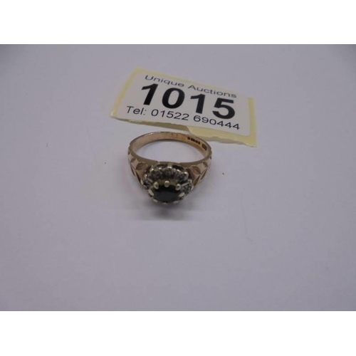 1015 - A 9ct yellow gold sapphire and diamond ring, size N, 3.2 grams.