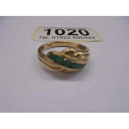 1020 - A 9ct yellow gold emerald and diamond ring, size P, 2.6 grams.