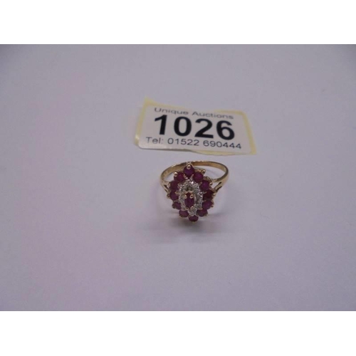 1026 - A 9ct yellow gold ruby and diamond ring, size N, 2.4 grams.