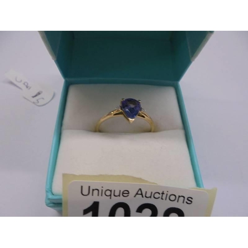 1028 - A yellow gold sapphire and diamond ring, size P half, 1.3 grams.