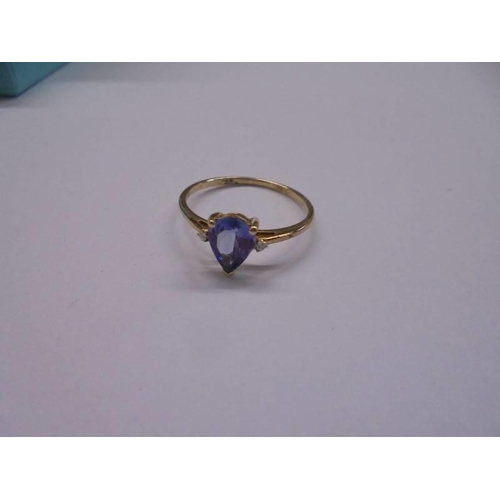 1028 - A yellow gold sapphire and diamond ring, size P half, 1.3 grams.