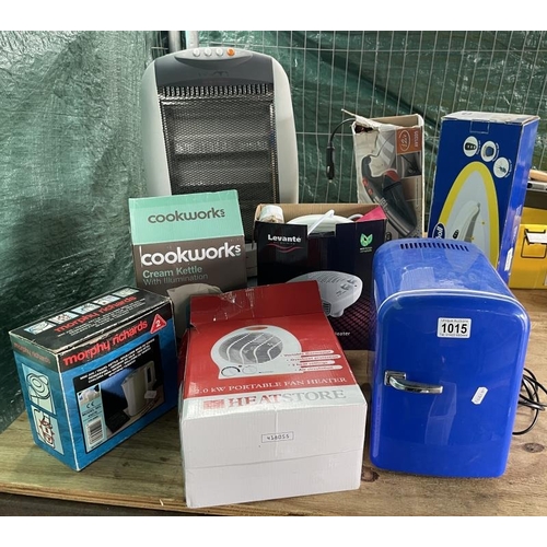 1015 - A quantity of house hold electrical items including, mini fridge portable heater, cooks kettle etc