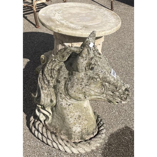 1040 - A quantity of Garden ornaments, horse heads and pillar stands