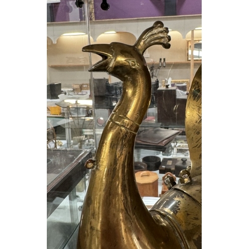 1129 - A vintage brass peacock shaped hot water jug