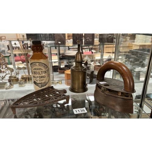 1136 - An early clothes iron with cast iron stand, A brass lamp & A stoneware ginger beer bottle (G.Boulton... 