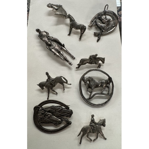 1139 - Some pewter equestrian brooches & A large Royal Worcester Palissy cup & saucer (Fox hunting themed)