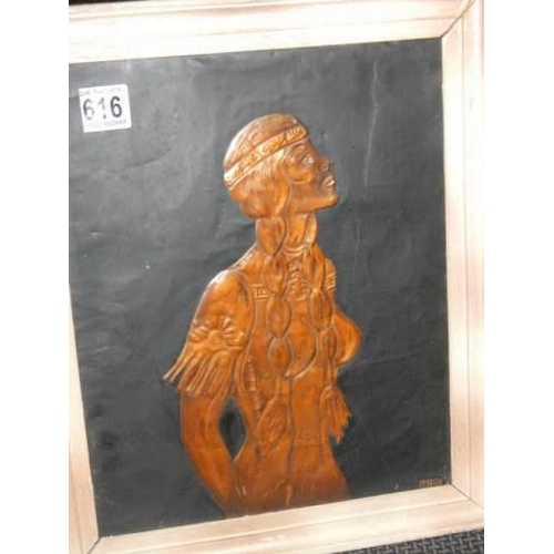 616 - A hammered copper plaque featuring a native American Indian Squaw.